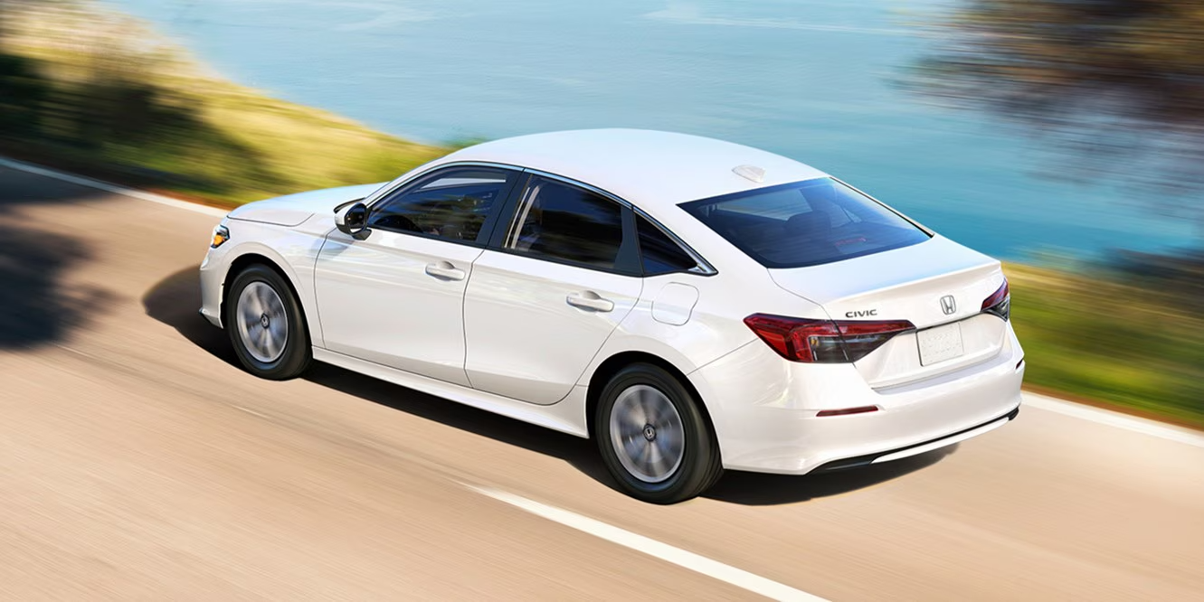 2026 Honda Civic Sedan driving action shot -- fuel efficiency on Clarksville roads