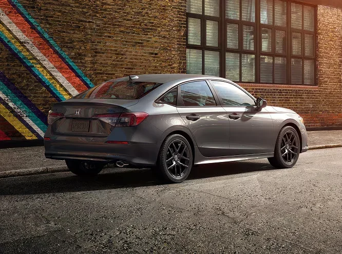 2026 Honda Civic Sport rear three-quarter view, Meteorite Gray Metallic