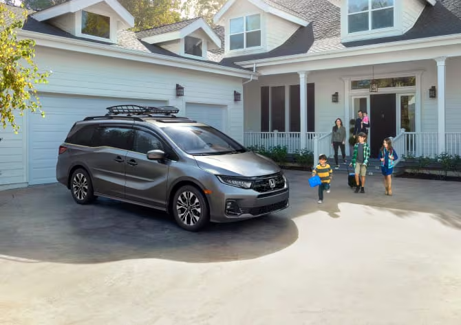 2026 Honda Odyssey exterior lifestyle shot sliding doors family loading